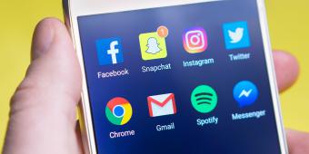 Social media apps open on a phone